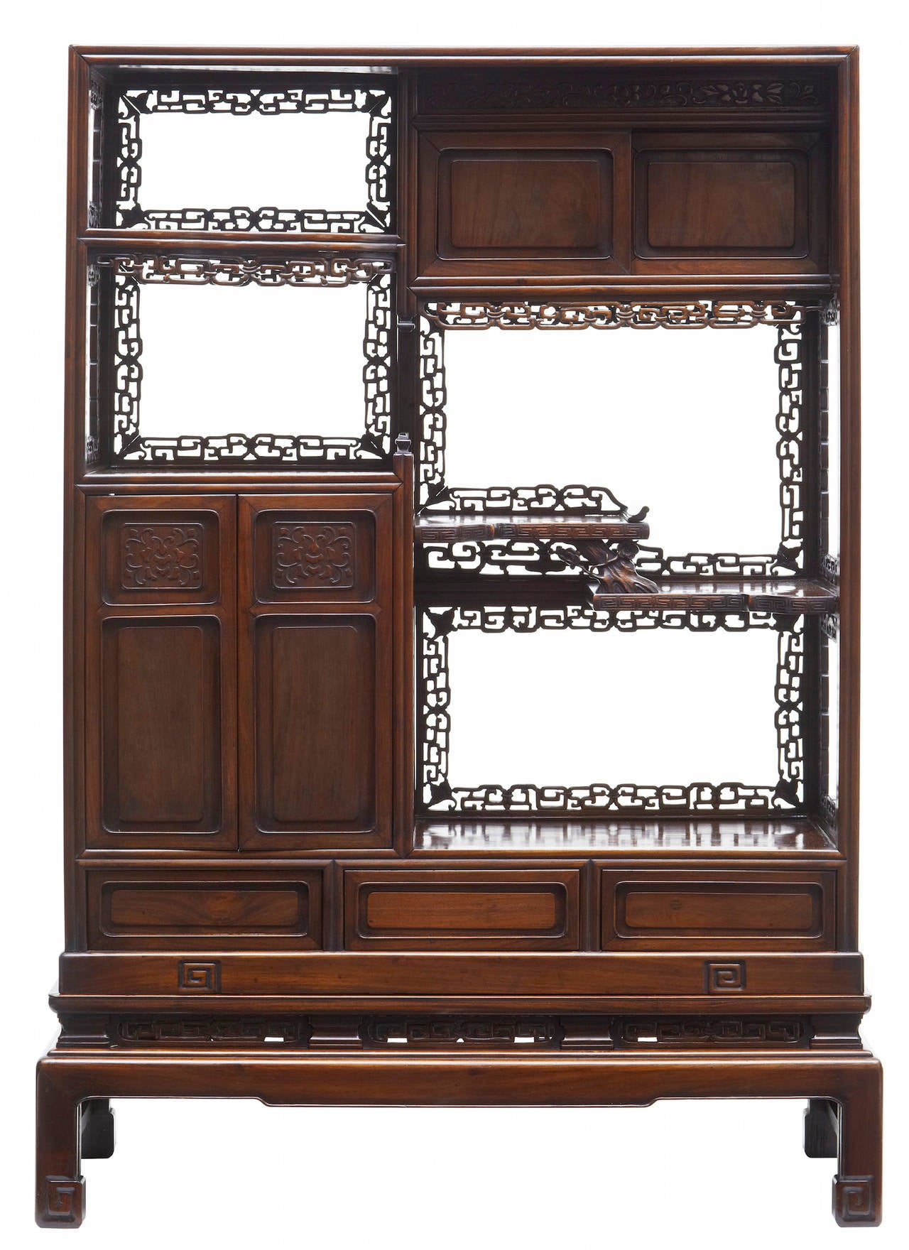 Good quality cabinet in what we believe huanghuali wood 

Comprising of open display apertures, sliding door cupboards, double door cupboard and shelfs and 3 drawers in the bottom. All profusely adorned with meandering key pattern.