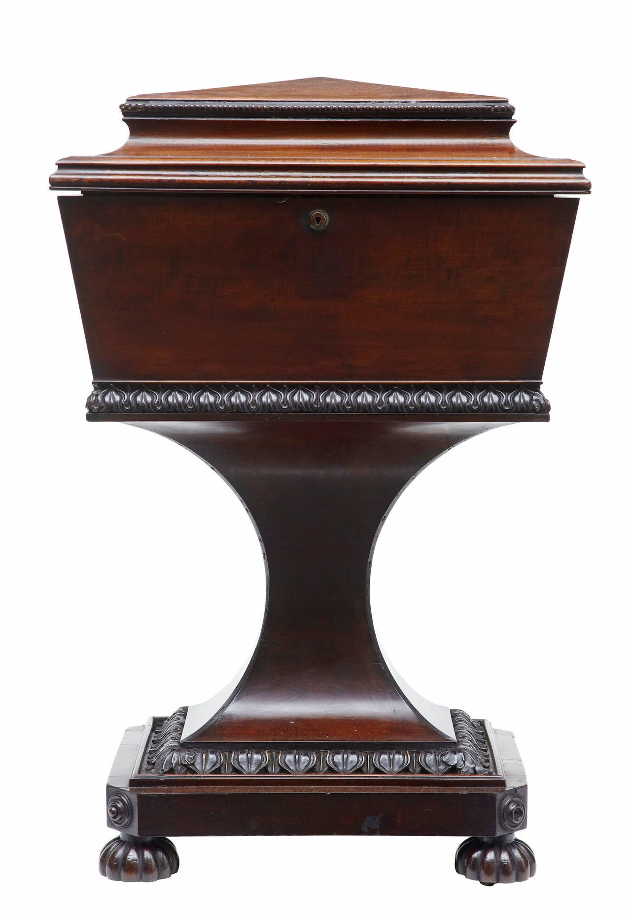 19th century carved mahogany teapoy stamped Gillows

Superb quality Gillows regency mahogany teapoy, circa 1820.

The main body being of sarcophagus form, which opens to four mahogany slides on each corner, one large tole compartment flanked