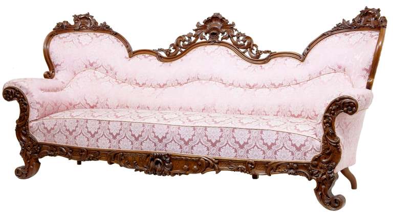 Stunning Quality Profusely Carved Mahogany Sofa Circa 1870.

Carvings To The Back Rail, Arms, Front And Legs To This Quality Serpentine In Shape Sofa Settee, Large In Proportions In That It Seats A Very Comfortable 4.

Carvings Depict Flowers,