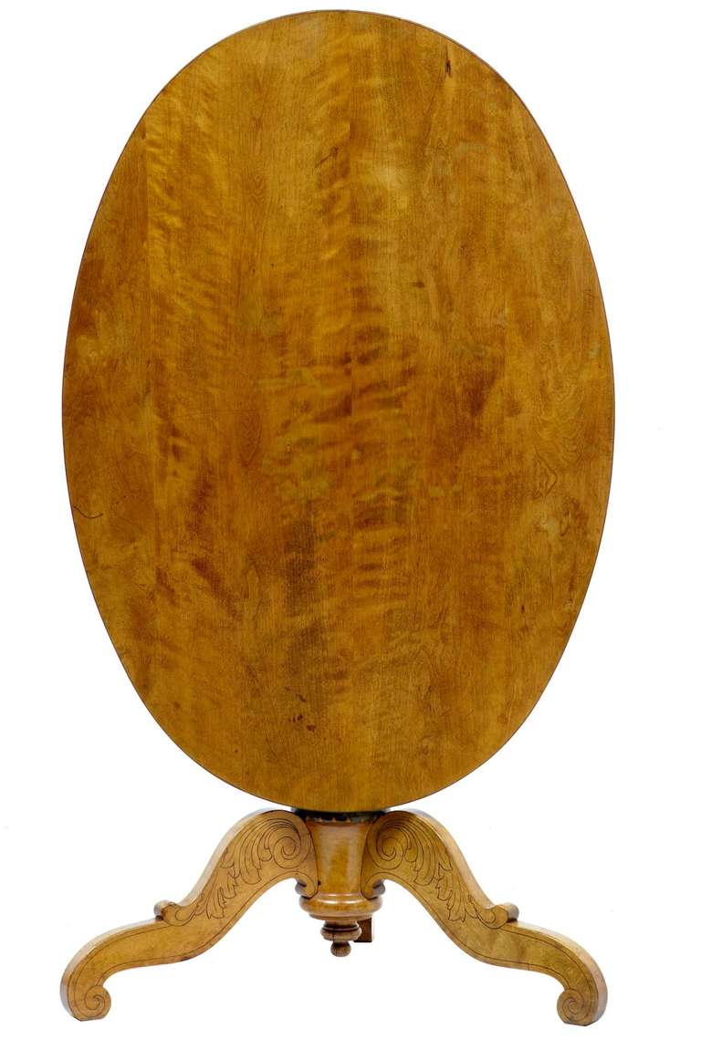 19th century Swedish birch tilt-top oval table

Excellent quality birch table with very color, circa 1850.

Stunning top, turned stem with tripod base featuring carved chasing depicting scrolls and foliage.