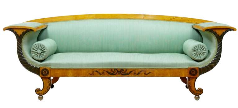 Stunning birch sofa with painted decoration circa 1840.

Beautiful large sofa featuring painted decoration to the arms and freize, applied carving to the arms. Standing on scroll and ball legs.

Seat Height: 16