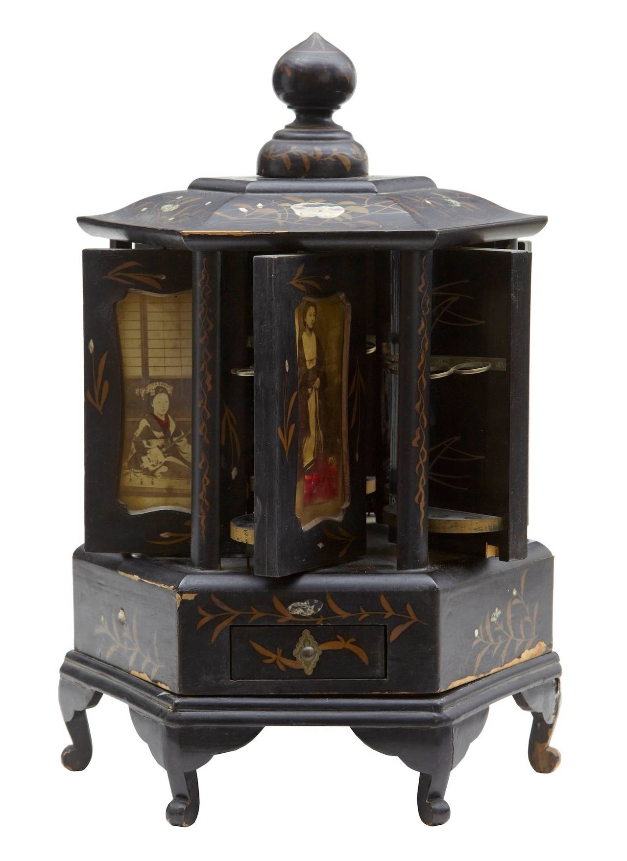 19th century Japanese black lacquer decorative cigar box

Unusual black lacquer cigar box circa 1890.

Made for the western market, this pagoda shaped cigar cabinet rotates to reveal cigar storage space.

Features photographs of Japanese
