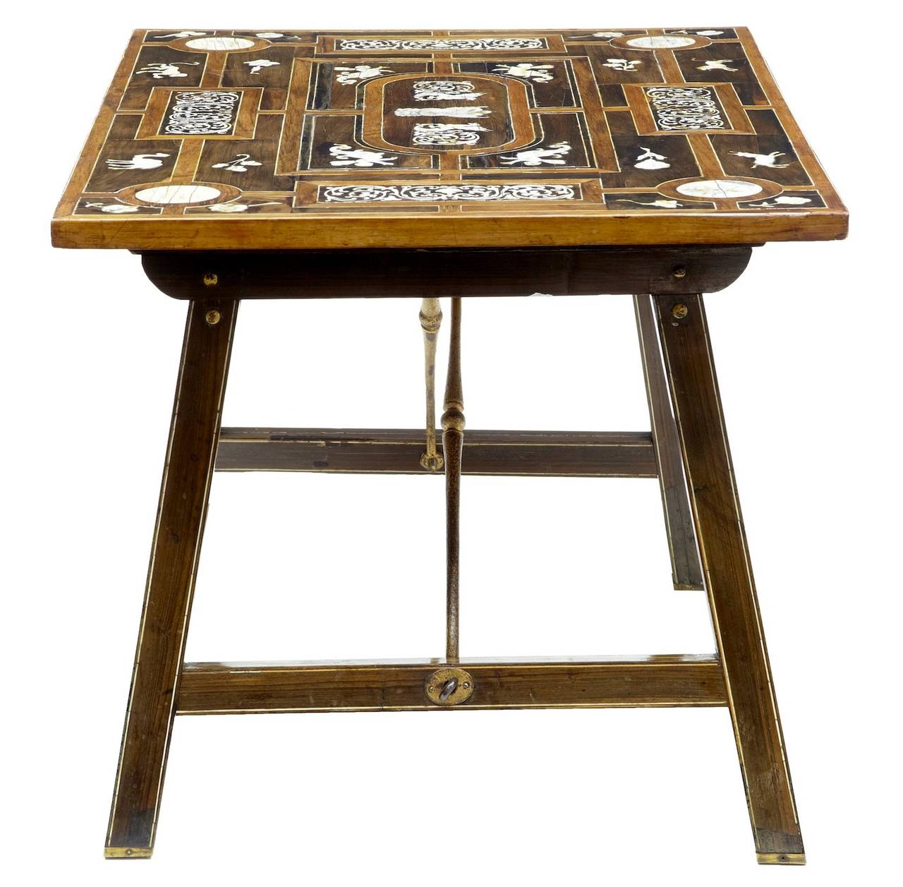 19th century profusely inlaid rosewood side table

Continental bone inlaid table, circa 1880. 

Possibly Spanish. 

Standing on trestle legs which fold flat, supported by iron stretchers.

Measures: Height 19 1/4