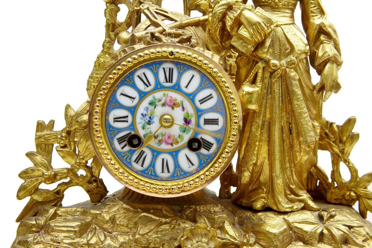 Ornate French gilt clock, circa 1890 

Decorated with Sèvres plaques and roundels.

Two losses each side of the clock (see pictures)

Pendulum will be correct length when sold.

Measure: Height 14 3/4