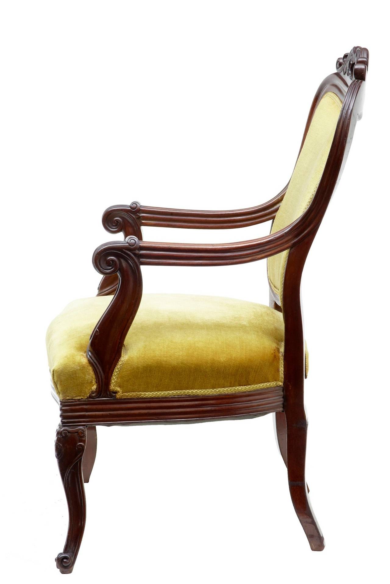 Carved mahogany armchair, circa 1840 

Carved back with open handle area, scroll arms. 

Measures: Height 39