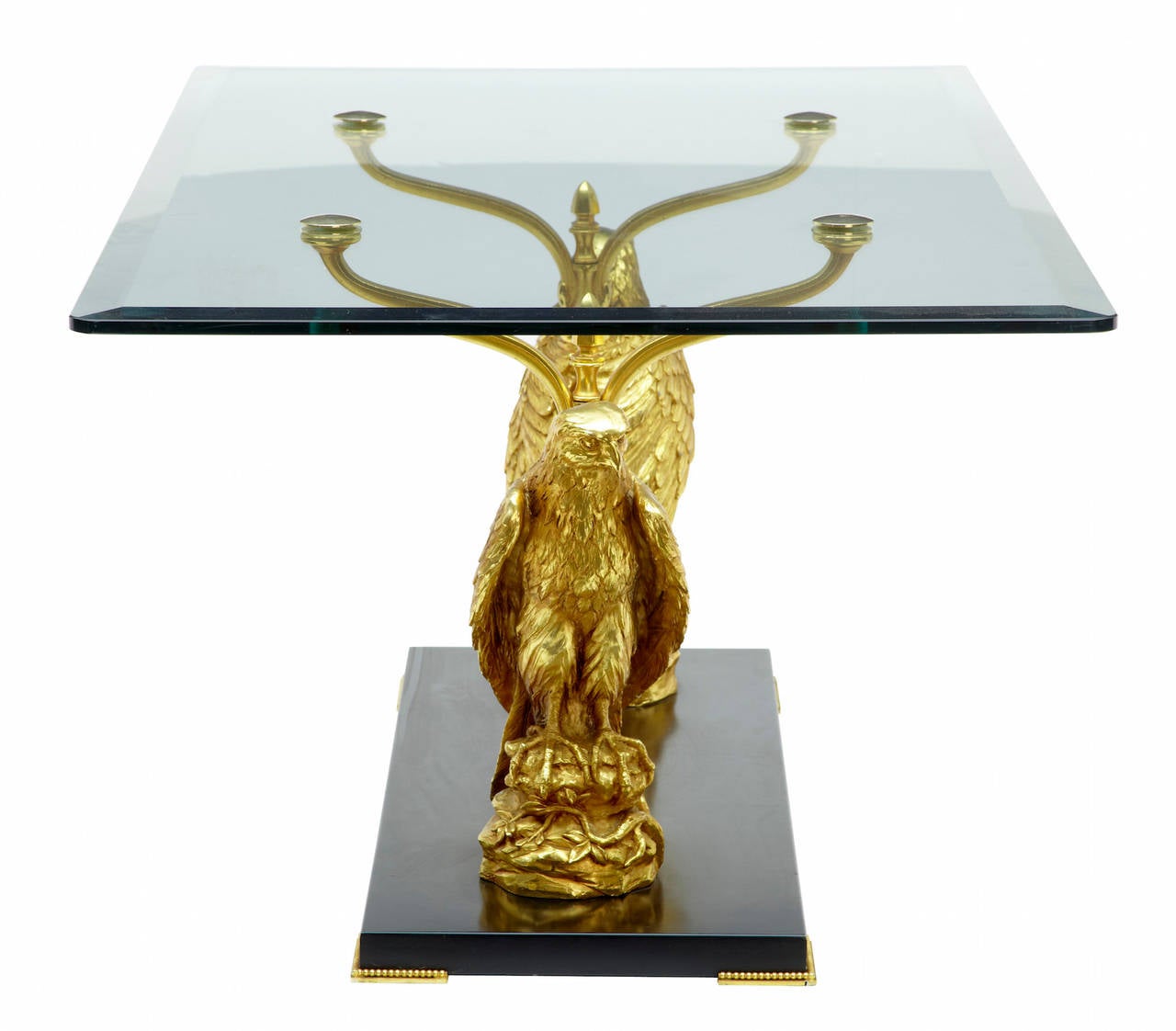 20th century designer Italian gilt eagle glass top coffee table

Designer table gilt coffee table circa 1960-1970

Stamped 'fioretta' with serial number. Bevelled glass top is supported by two finely cast eagle/birds of prey, standing on black