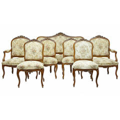 19th Century French Carved Walnut, Seven-Piece Salon Suite of Sofa and Chairs