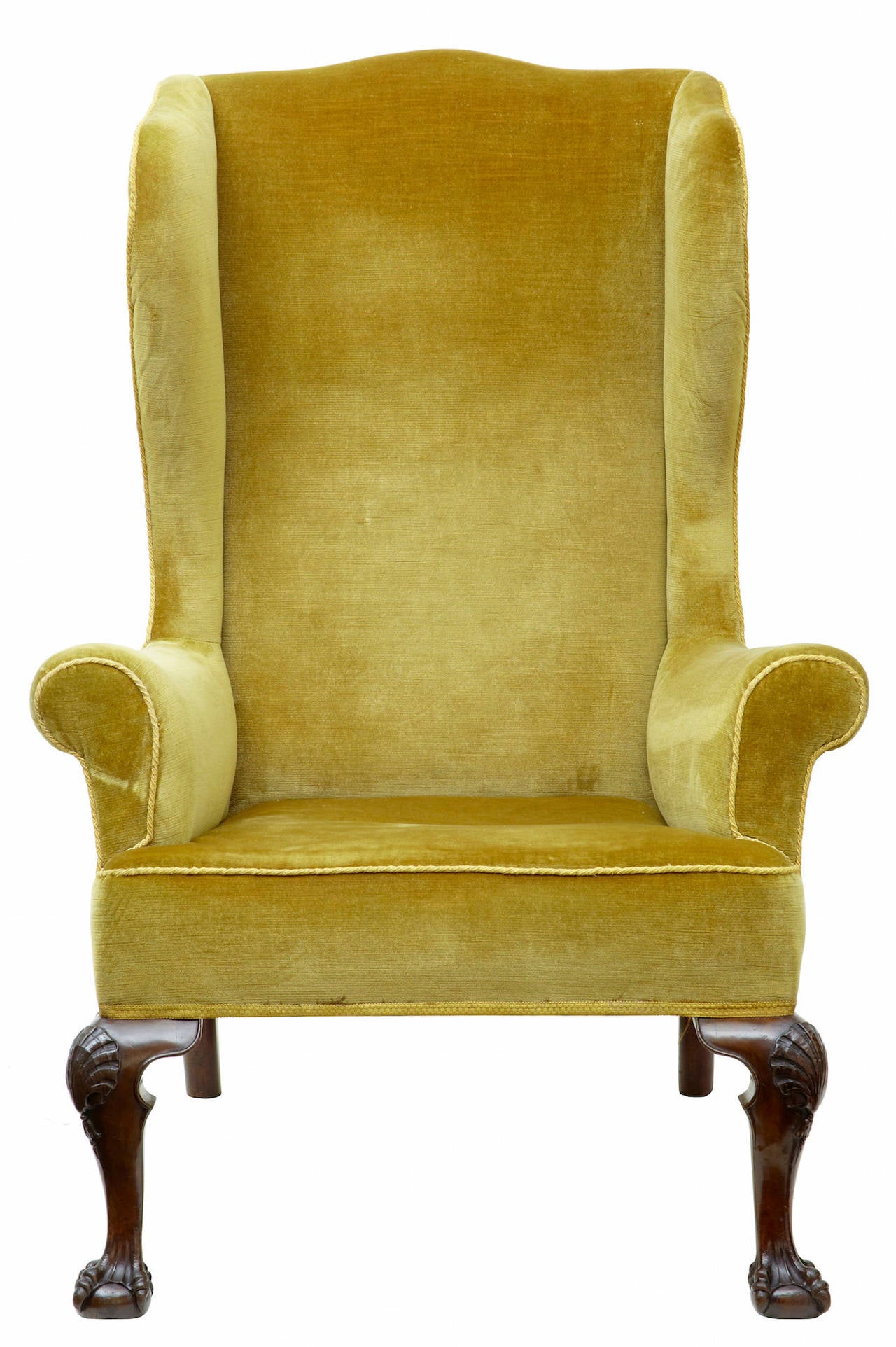 Fine quality Irish oversized armchair circa 1770. 

Very comfortable oversized armchair in golden crushed velvet. Standing on ball and claw feet with carved shell on the knee 

Seat height: 18