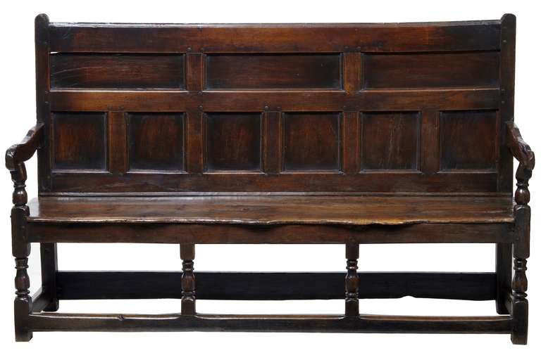 One of the most genuine settles of this type you will find on the internet, circa 1690.

Beautiful colour and patina on this stunning settle bench with original seat.

Standing on four turned legs at the front united by Stretcher.

Very minor