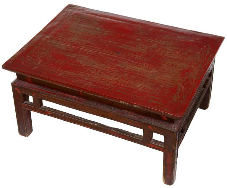 Here we have a low practical occasional table, circa 1880.

Richly colored table, with distressed paint showing at least two shades, some areas showing complete paint loss. Some light scuffing and marks. Original condition.

Beautiful table with