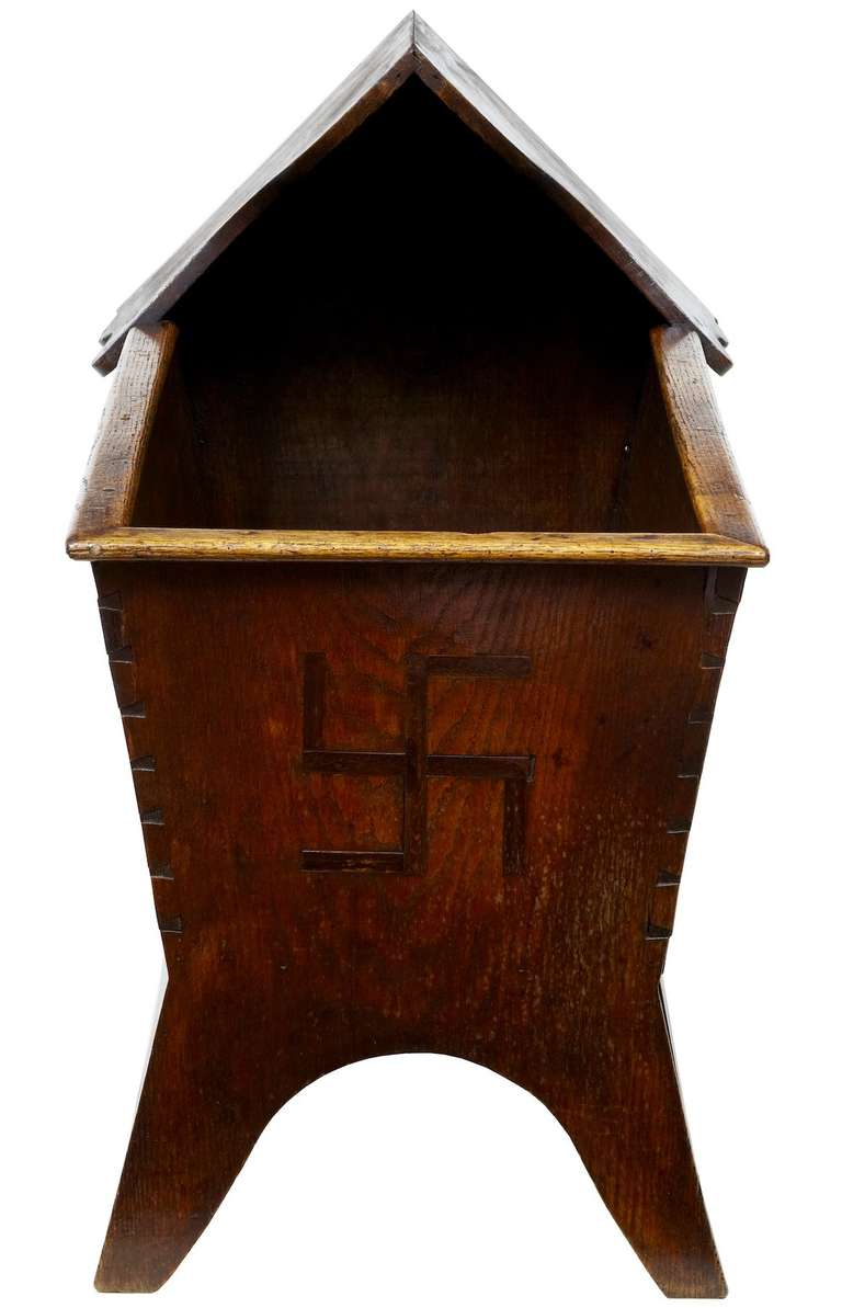 Young childs oak cot, circa 1880

Good color and patina, obviously the main feature of this piece is the inlaid Swastika at the end. Not to be confused with the symbol the Nazi Party adopted in 1920, when they turned the symbol 45 degrees to the
