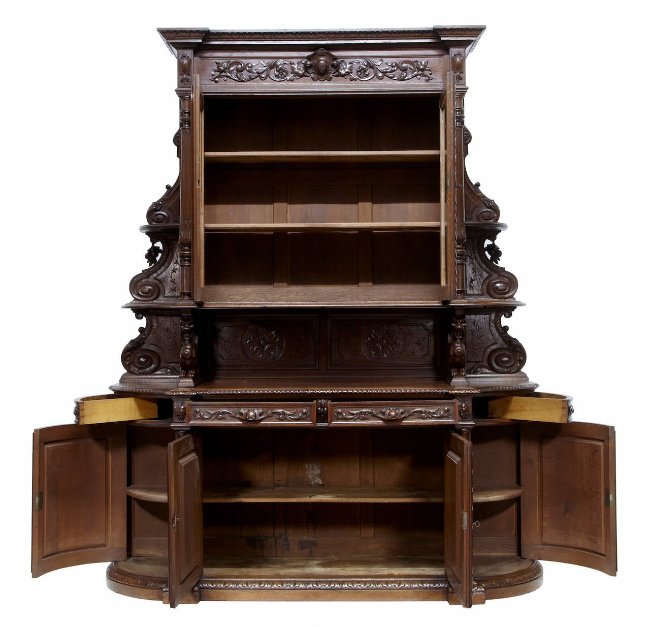 Stunning carved flemish hunt dresser circa 1870. 
Comprising of 3 sections. 
Top section with glazed double door containing 2 shelves, flanked either side by columns and rounded open shelves. 
Dragon supports lead down to the bow end base which