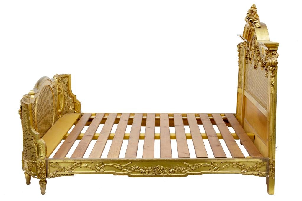 19TH CENTURY CARVED WOOD AND GILT FRENCH KINGSIZE BED <br />
<br />
STUNNING GILT FRENCH BED WHICH WOULD TAKE A KINGSIZE MATTRESS.