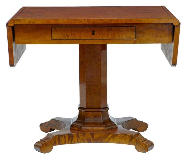 Swedish birch one-drawer sofa table, circa 1890.<br />
<br />
With ebonised lining to top, central column standing on quadriform base.