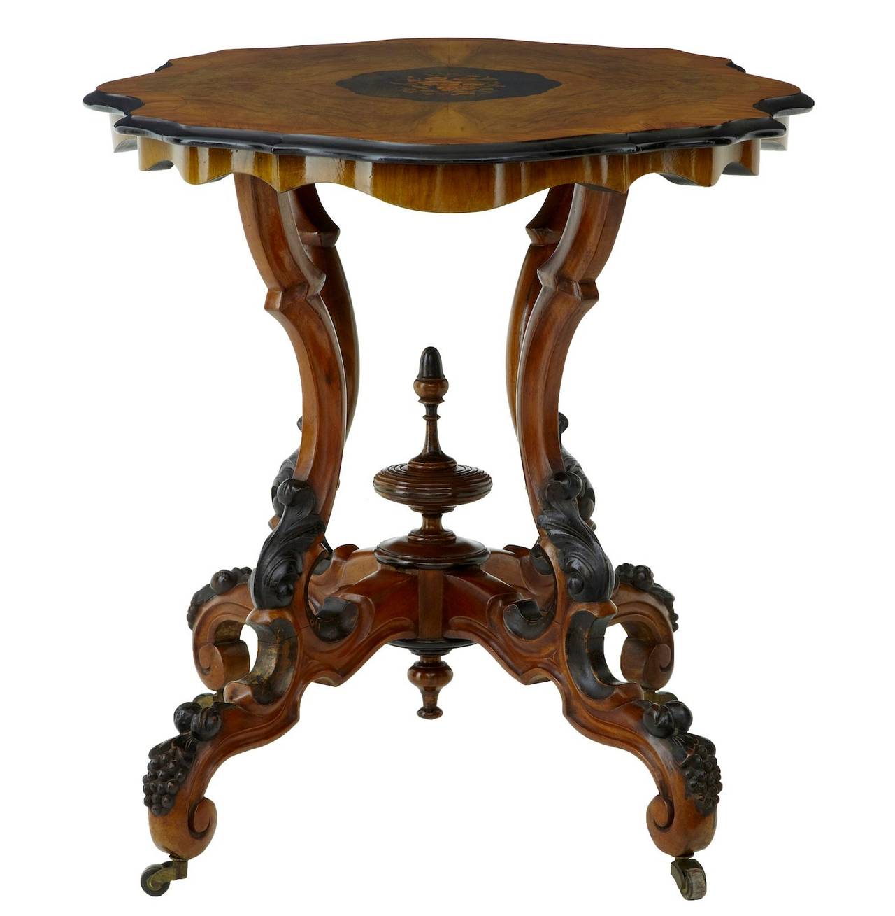 19th century high Victorian inlaid walnut center table
Fine quality walnut inlaid occasional table, circa 1870. 
Central inlaid floral section, using birch and walnuts veneers. Walnut top crossbanded in satinwood with ebonised shaped edging.