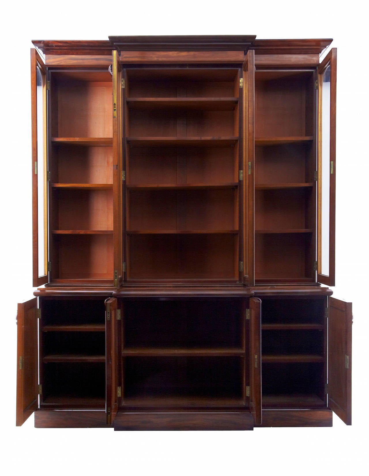 Finest quality bookcase, circa 1850.
Comprising of five sections. Plinth, cupboard, middle section, glazed unit and cornice.
Made front the finest quality matching veneers.
With applied lambs tongue carvings. Swags and beading to doors.
Top