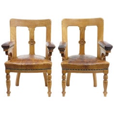 A Pair Of 19th Century Arts And Crafts Oak Elbow Library Chairs