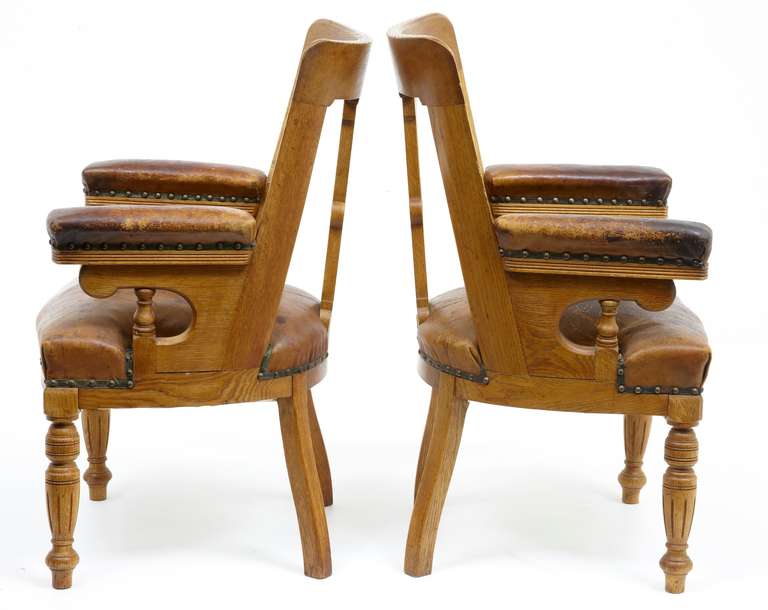 A Pair Of 19th Century Arts And Crafts Oak Elbow Library Chairs