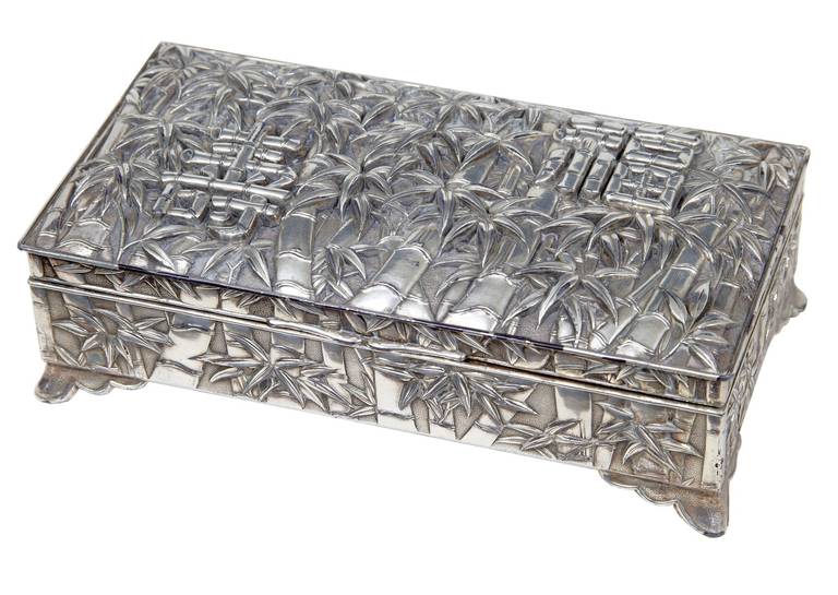 20th century silver plate Chinese bamboo decorated tobacco box

Fine quality Chinese silver plate box, signed and dated 1925.

Profusely cast and decorated with bamboo and bamboo stylized Chinese text.

Slight losses to plate and separation of