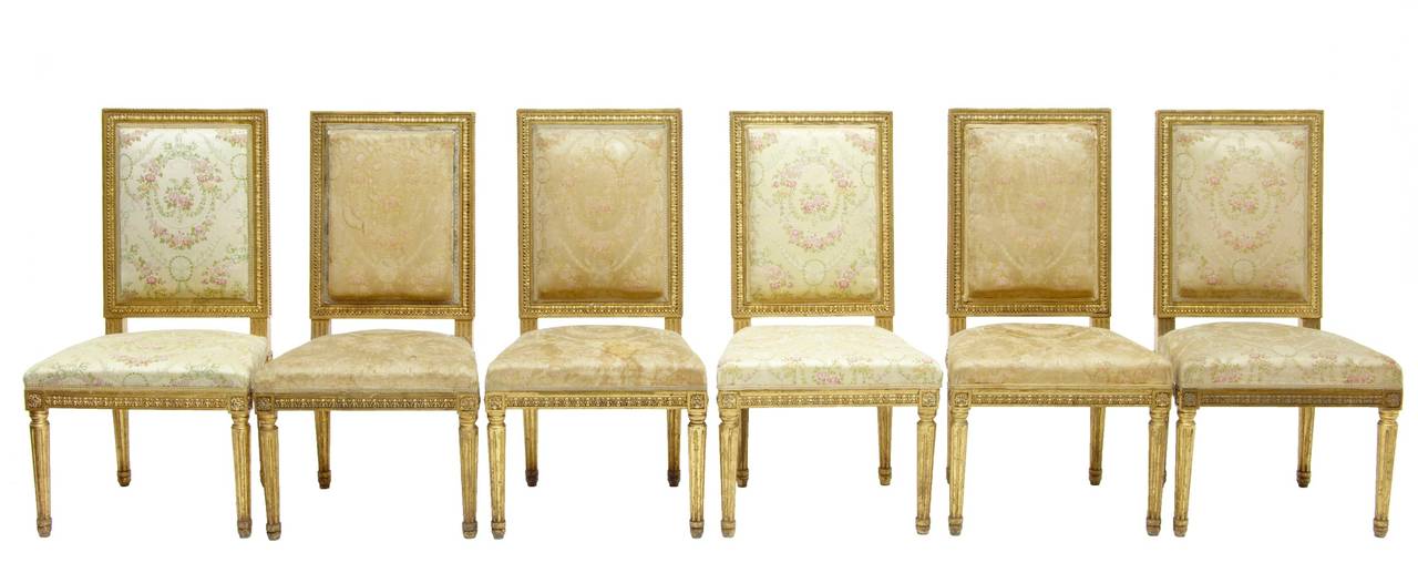 Here we have a stunning gilt suite  comprising of 1 large sofa, 1 small sofa, 4 armchairs and 6 single chairs circa 1870.

Carved backs and rails, with fluted legs.

Large sofa measurements:  height: 40