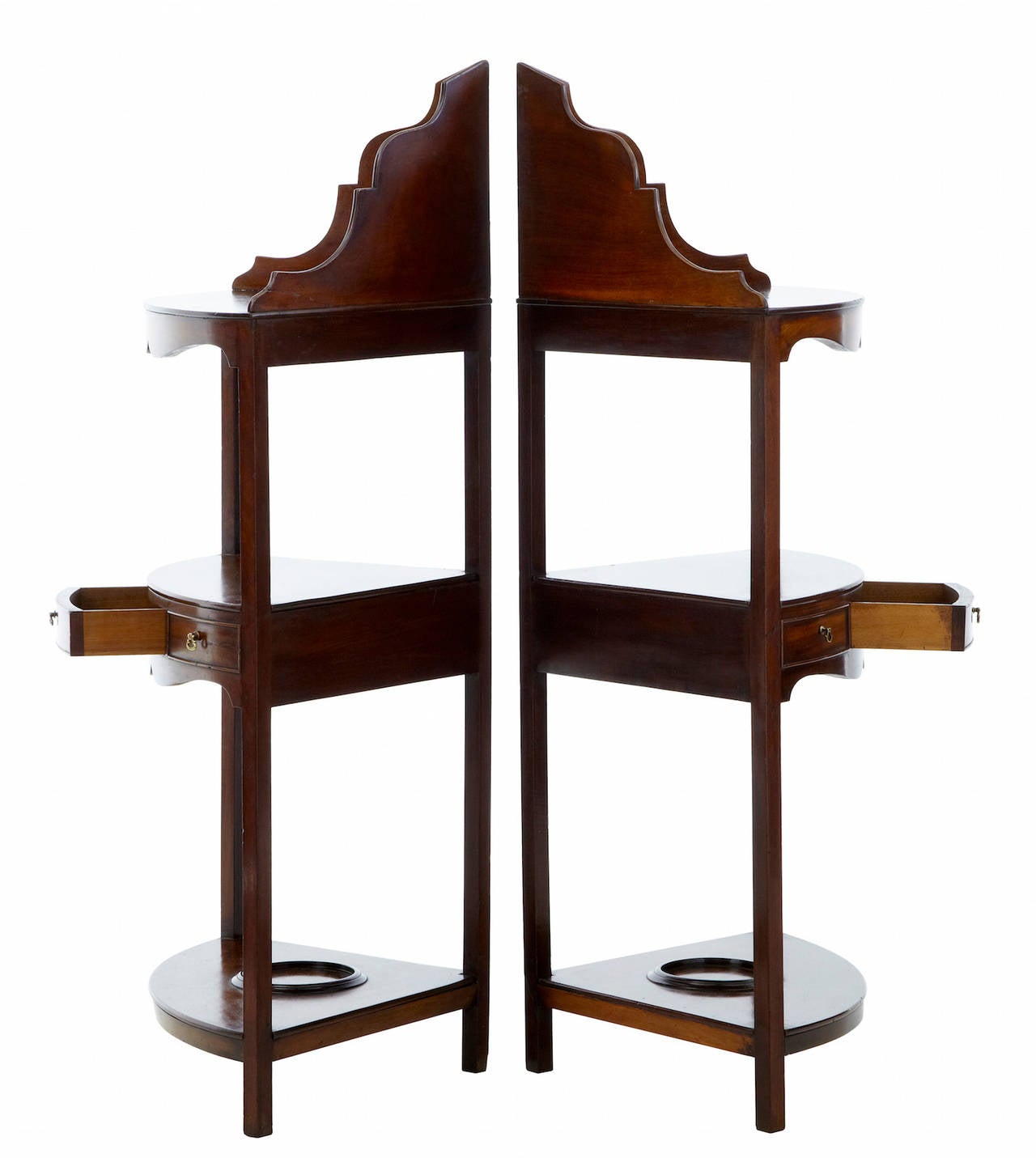 Pair of late Victorian mahogany corner washstands, circa 1890.
Gallery top comprising of three tiers, second tier with one drawer and two dummies, bottom tier with bowl cradle.
Minor repairs to gallery top.

Measures: Height 42
