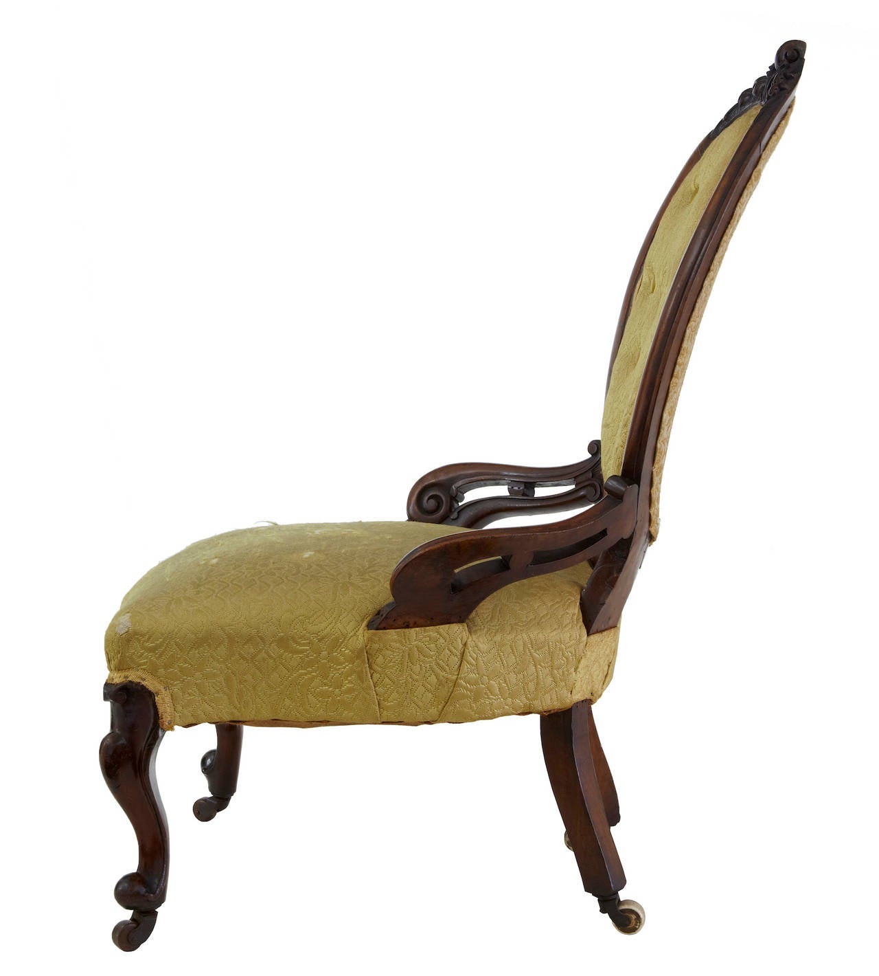 Carved mahogany nursing chair, circa 1850
Carved backrest with buttonback, carved and pierced arms.
In need of recovering but structurally sound.

Measures: Height: 37