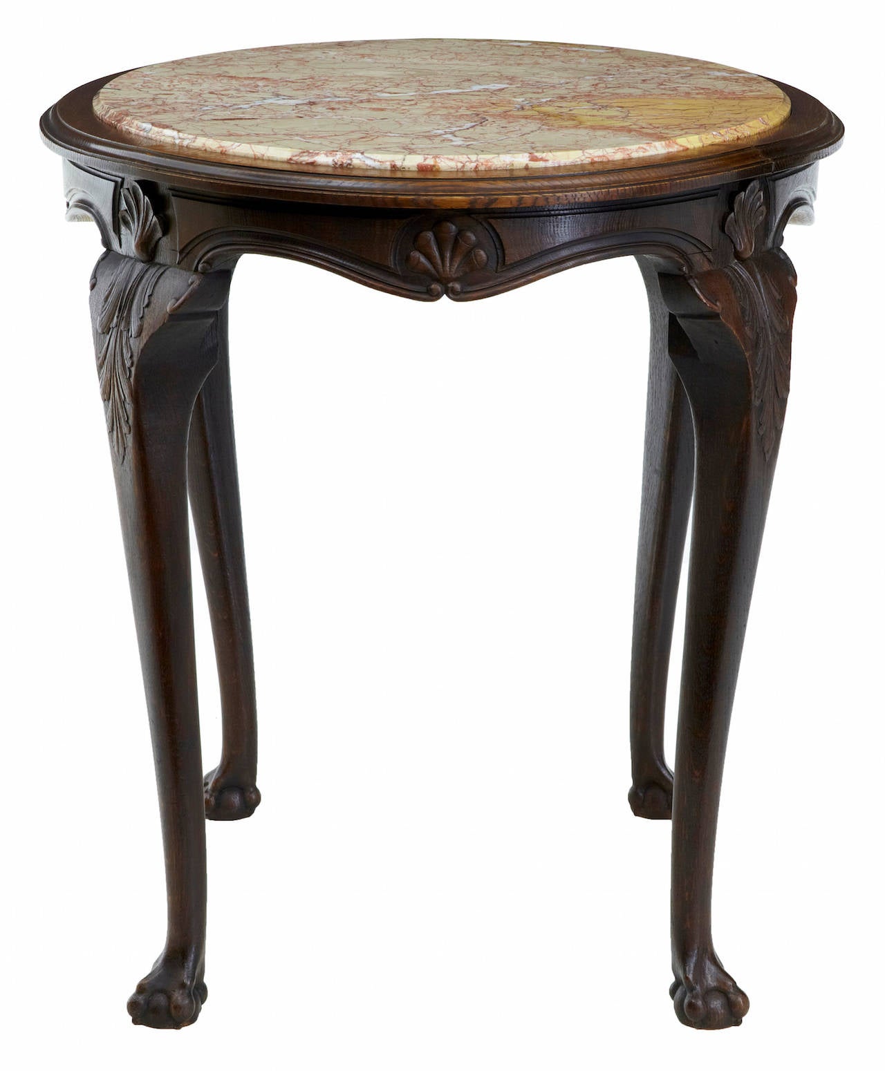 Oval French marble top table, circa 1870.
Inset veined marble top, standing on carved cabriole legs with leaves and shells. Terminating on ball and claw feet.
Restoration to one side (photographed)

Measures: Height: 29 3/4