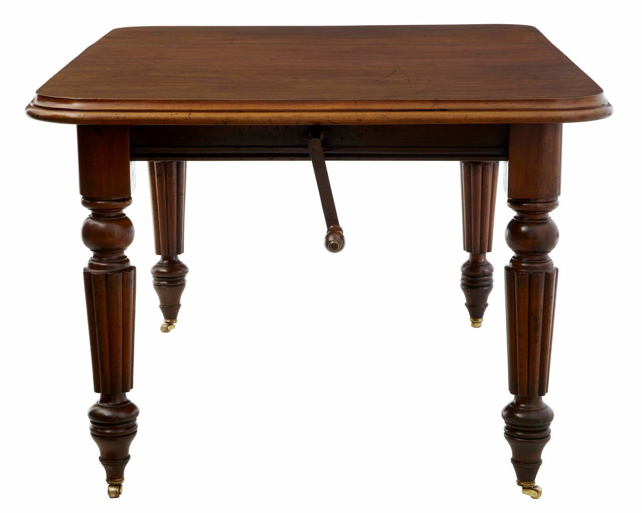 Small mahogany dining table, circa 1870. Extending with one leaf, would seat a comfortable six. Standing on fluted legs with brass castors. Marks to top, please see pictures.
Measures: Height 29 1/2