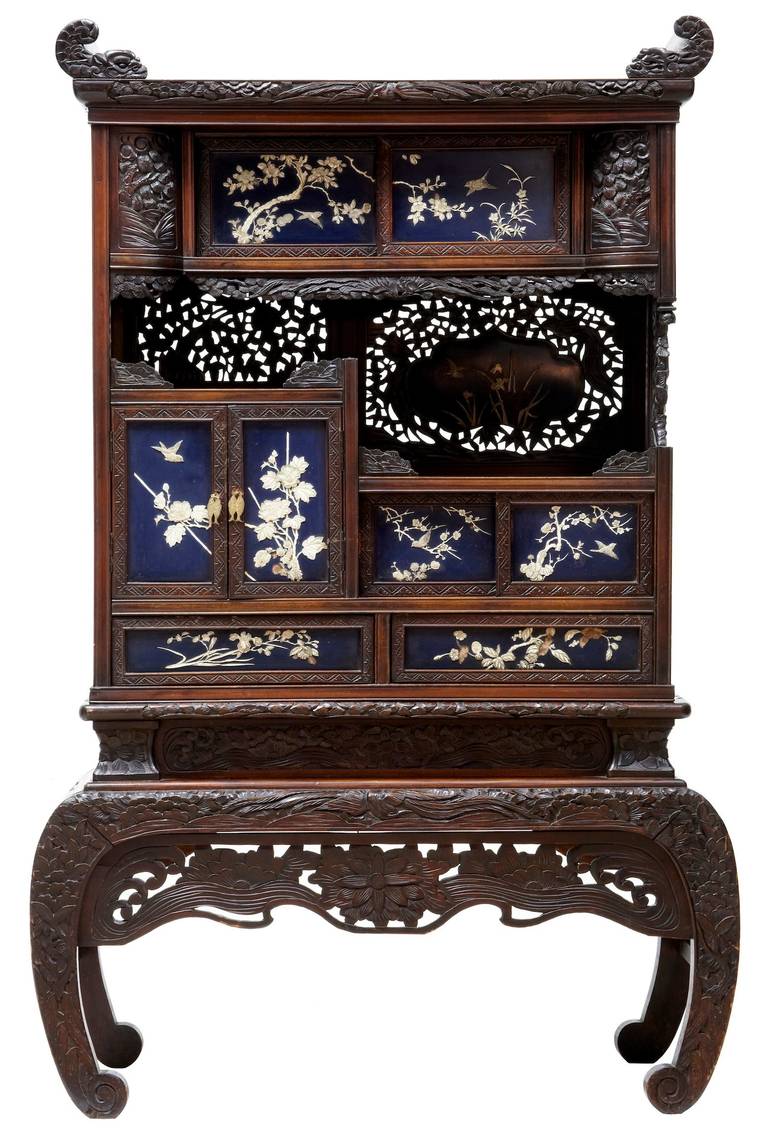 Stunning Japanese decorative cabinet carved and pierced detailing circa 1890, of nice small proportions 

Comprising of a sliding door cabinet on the top, and open aperture with pierced detail to the rear panel. A double door cupboard with a