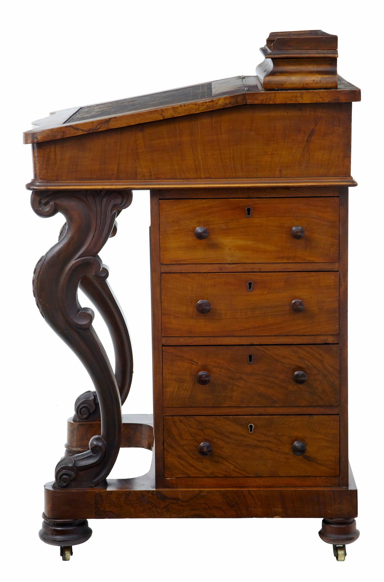Good quality davenport in original condition, circa 1870. Enclosed pen tray above the writing slope which still has the original leather in place. Slope opens to reveal a satinwood interior containing a single drawer and two pigeon holes. Four full