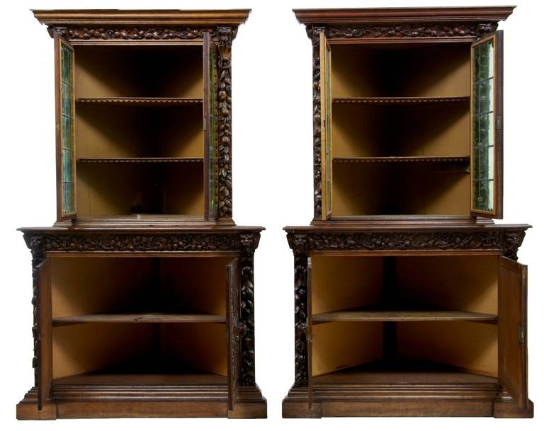 Rare pair of Flemish oak corner cabinets, circa 1850.

Please note we have a further pair of these which makes a set of four, which we are selling also as a set of four for a discounted price.

Profusely carved with lion heads and foliage.