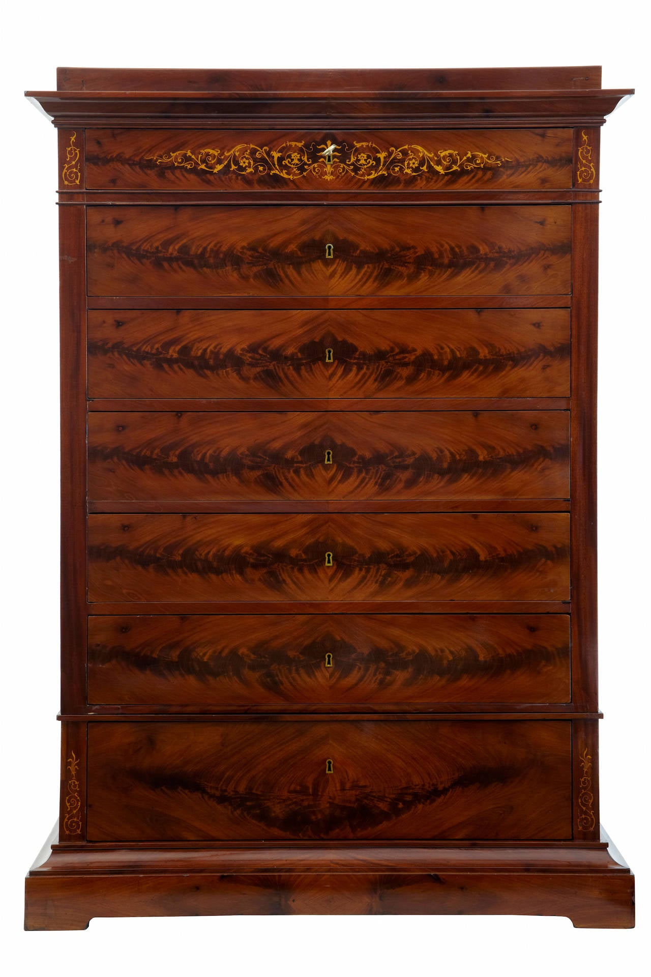 Fine quality Danish chest circa 1850. 2 part chest which splits at the lowest drawer. 7 graduating drawers, the top drawer with floral inlay. Each drawer with lock. Minor veneer repairs to base.

Measures: Height: 58 1/4