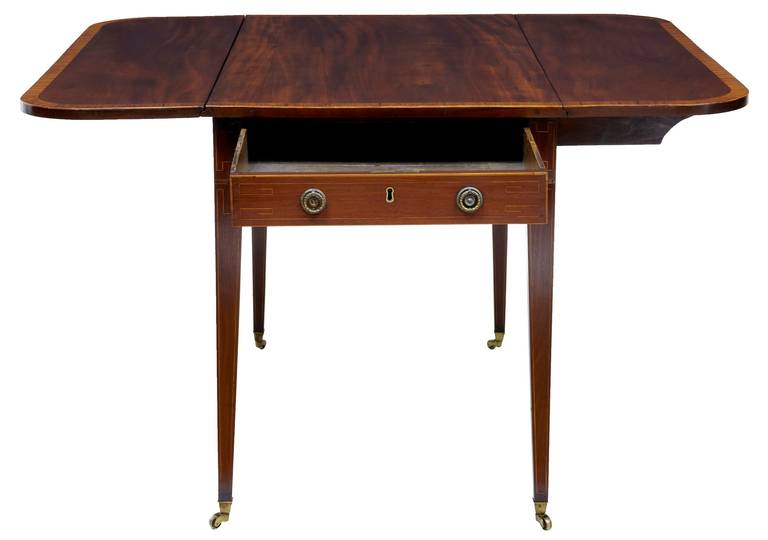 Beautiful late Regency mahogany Pembroke table, circa 1820.

Of good color, crossbanded top and stringing to legs and single drawer front. Standing on tapered legs and original brass castors.

Missing one knuckle joint support, viewable in