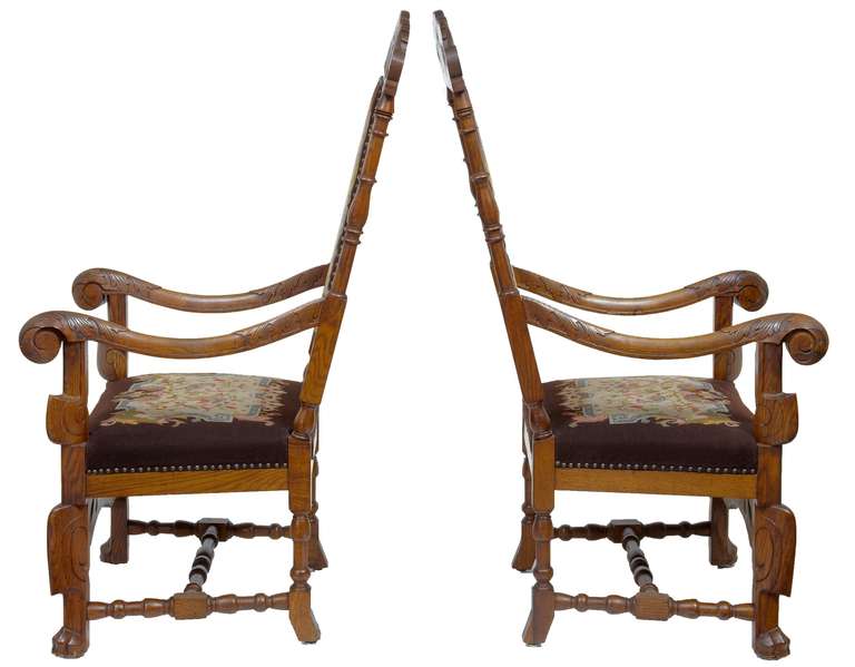 Fine pair of carved French oak armchairs with original tapestry upholstery. 

Measures: Height 51