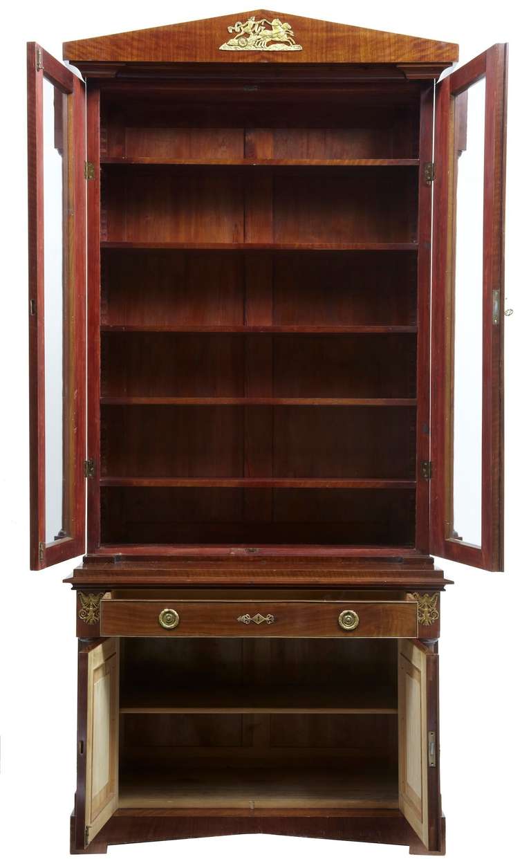 Here We Have A Tall Bookcase Cabinet. Top Section Comprises Of 5 Shelves, Moving To A Single Drawer And Finishing With A Double Door Cupboard With 1 Drawer. 

Adorned With Ormulu Mounts.