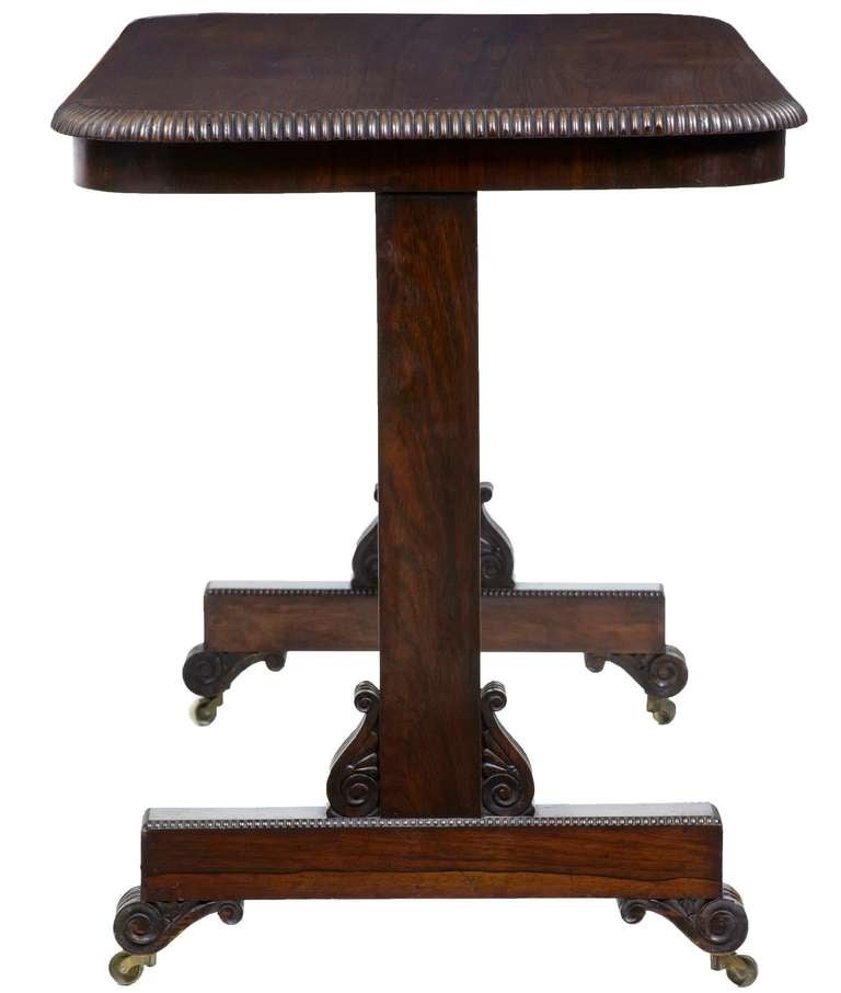 19th century Regency rosewood writing library table

Fine quality Regency library table. 

Deep gadrooned edge and a stunning patina to the top. 

Standing on original brass castors.