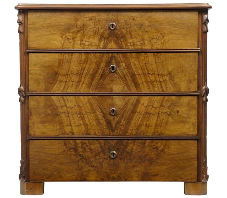 19th century carved walnut chest of drawers

fine walnut chest of drawers with good patina, foliage detail to the sides. 

We can add handles at cost if desired; these chests were designed to open on the key.
 