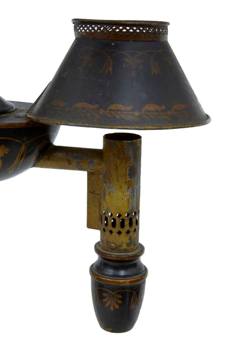 Early 20th century Swedish toleware lamp

Here we have a rare decorative toleware piece, beautifully painted in black and gold.

Could be rewired, but currently static.

Measures: Height 21