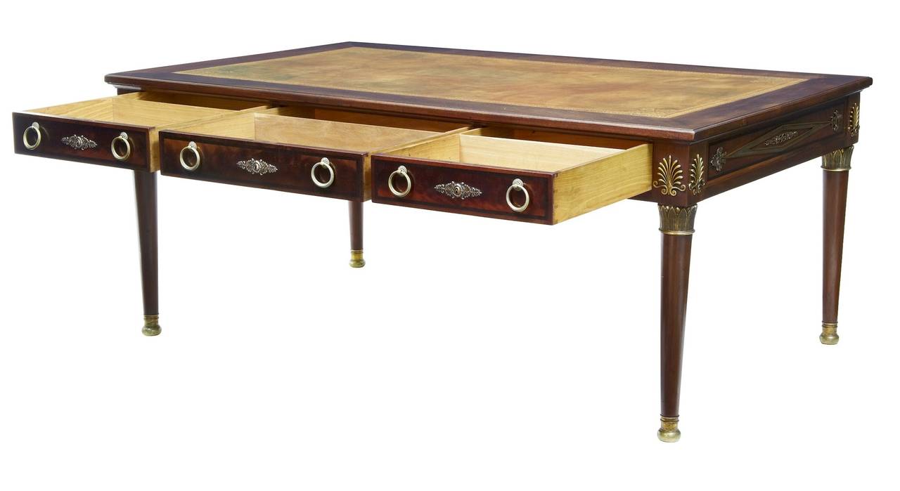 Stunning quality french mahogany desk circa 1860. 

Here we have a real statement piece of furniture, with original hardware. 

Beautiful leather top with gold tooling. 

3 deep drawers with partitions. 

Adorned with ormolu mounts.