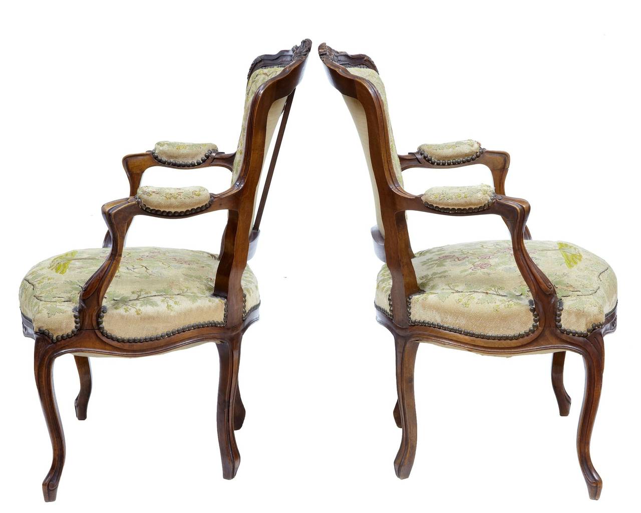 Fine pair of French carved walnut armchairs, circa 1870. 

Nice proportions on this pair of chairs, which original tapestry covering which depicts a tree on both the seat and back. 

Carved to the top of the backrest and front rail. 

Armpads