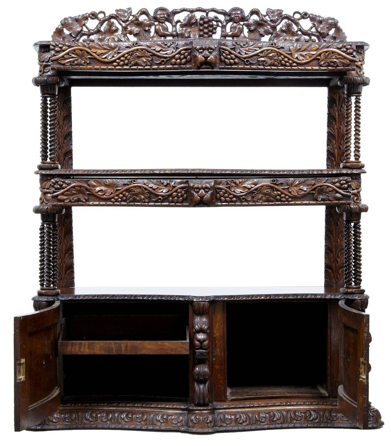 Beautiful quality carved oak buffet, circa 1870. 

Comprising of three tiers, pierced carved gallery above and double door cupboard below. 

One drawer in the top two tiers, cupboard below opens to a single drawer on one side and cupboard space