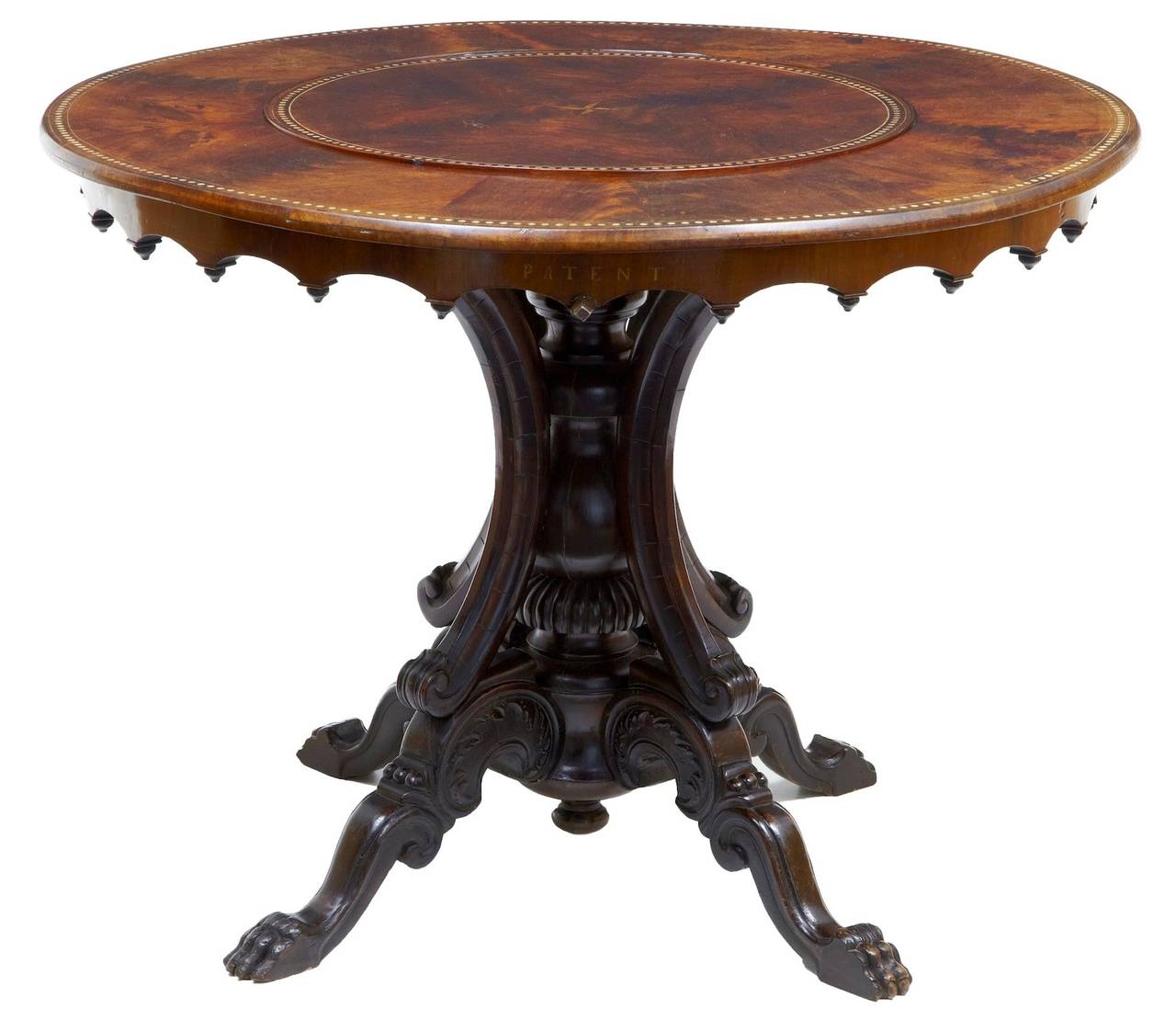 Very rare flame mahogany lazy Susan table, circa 1880. 

Here we have a unusual center table, which incorporates a mechanized lazy Susan device. Due to the size of the table and the inlaid 'patent' lettering to the side, we can only assume that