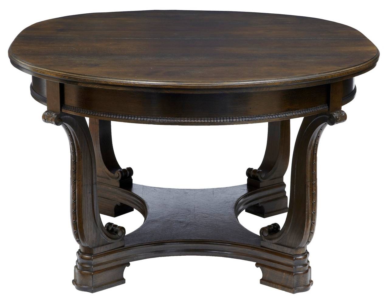 Swedish oak extending table with leaves circa 1880. 

Carved lyre shaped legs 

Typical with swedish leaves of the period they are primitive compared to the table, but they give an extra 100 1/2 inches, making this table capable of seating