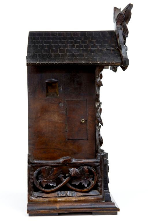 19TH CENTURY ANTIQUE GERMAN BLACK FOREST CUCKOO CLOCK<br />
<br />
IN GOOD CONDITION WITH WORKING BELLOWS THAT MAKE THE CUCKOO SOUND AND CHIME, LOVELY CARVED MANTEL VERSION OF THE POPULAR BLACK FOREST TRADITION. CIRCA 1890