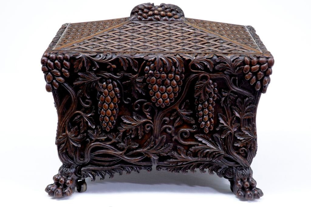19th century antique heavily carved walnut wine cooler

Here we have a stunning wine cooler, profusely carved in walnut depicting fruit and foliage. Stands on four lion paw feet with castors 100% original. One Piece of carving missing which we