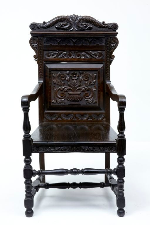 19TH CENTURY ANTIQUE CARVED ROSEWOOD WAINSCOT CHAIR<br />
<br />
UNUSUALLY CARVED IN ROSEWOOD<br />
<br />
VERY HEAVY AND STURDY BEAUTIFULLY CARVED CHAIR, WITH SEAT CUSHION<br />
<br />
SEAT TO FLOOR HEIGHT: 18