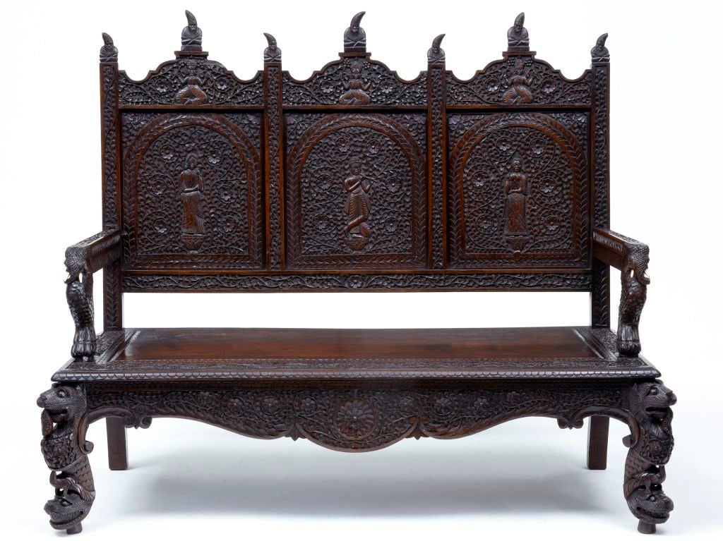 19TH CENTURY ANGLO INDIAN CARVED ROSEWOOD SETTLE BENCH<br />
<br />
STUNNING SETTLE THAT HAS BEEN CARVED ALLOVER.<br />
<br />
FEATURING DOUBLE LIONS ON THE FRONT LEGS AND ELEPHANTS ON THE ARMS, THREE CARVED PANELS ON THE BACK REST.<br />
<br