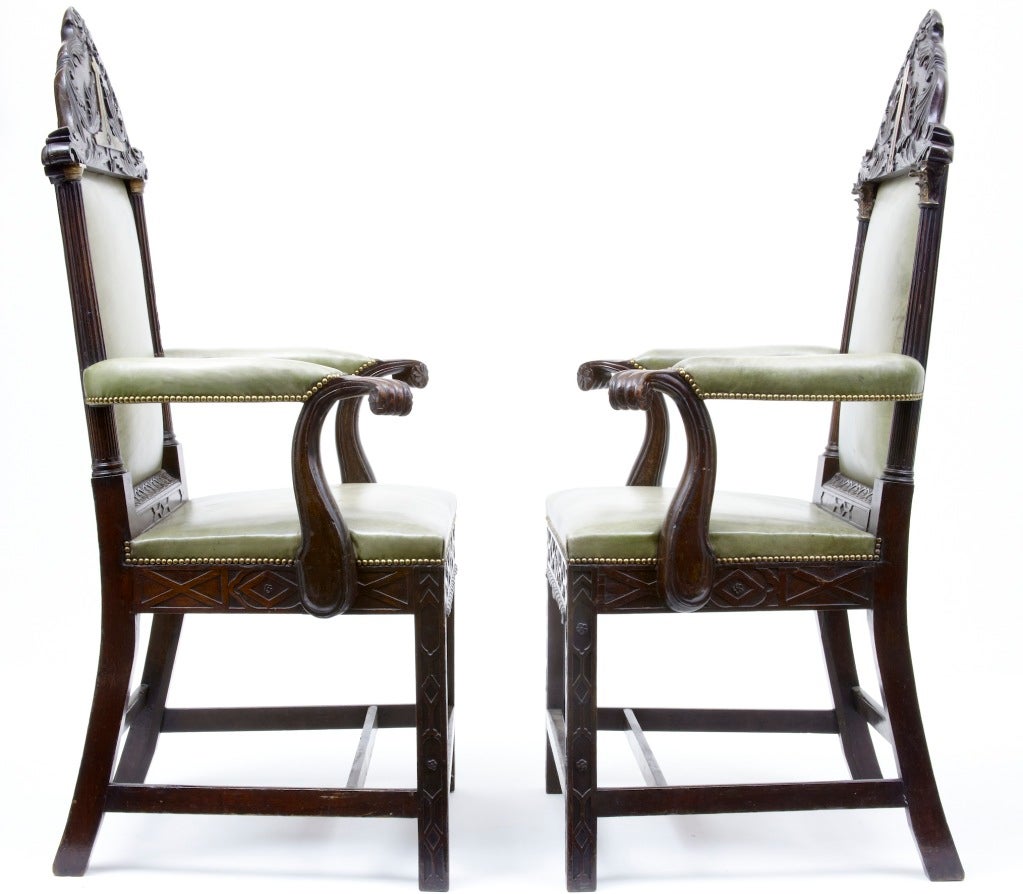 EARLY 19TH CENTURY PAIR OF MAHOGANY MASONIC THRONE CHAIRS<br />
<br />
SOLID MAHOGANY CHIPPENDALE IN STYLE, THESE CHAIRS ARE VERY RARE, FEATURING BLIND FRET WORK AND DORIC/CORINTHIAN COLUMNS, LEADING UPTO THE CARVED MASONIC PLAQUES