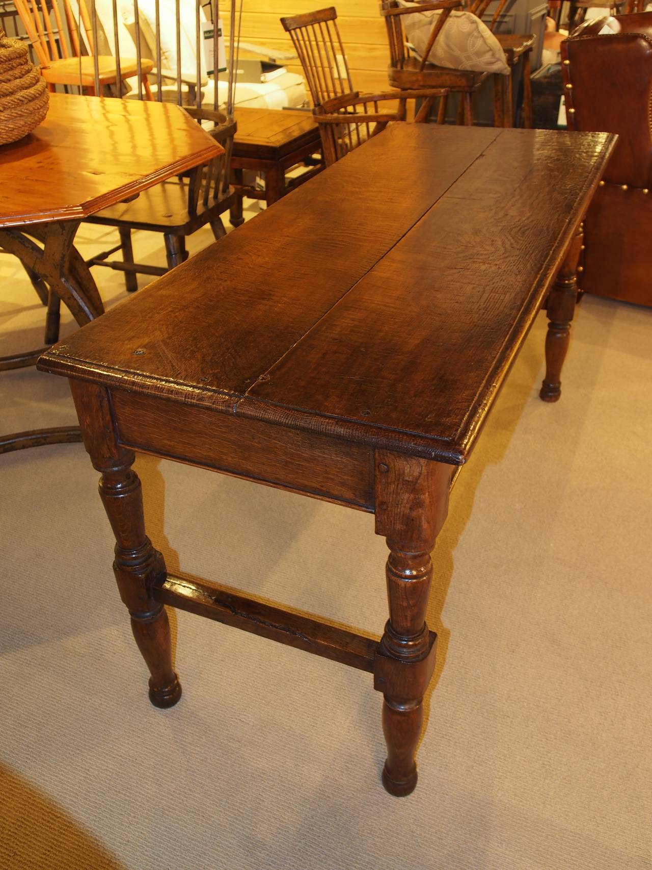 English solid oak console table with carved turning legs.