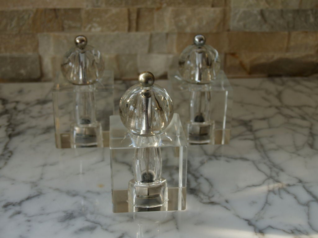 A set of three Dorothy Thorpe glass pepper grinders.

These are very rare.

They are beautiful cut-glass and are a show piece to your dining table. The condition of the three are excellent.